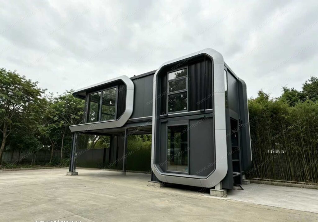 The internal galvanized steel framework of a modular capsule house being assembled in an ISO-certified factory